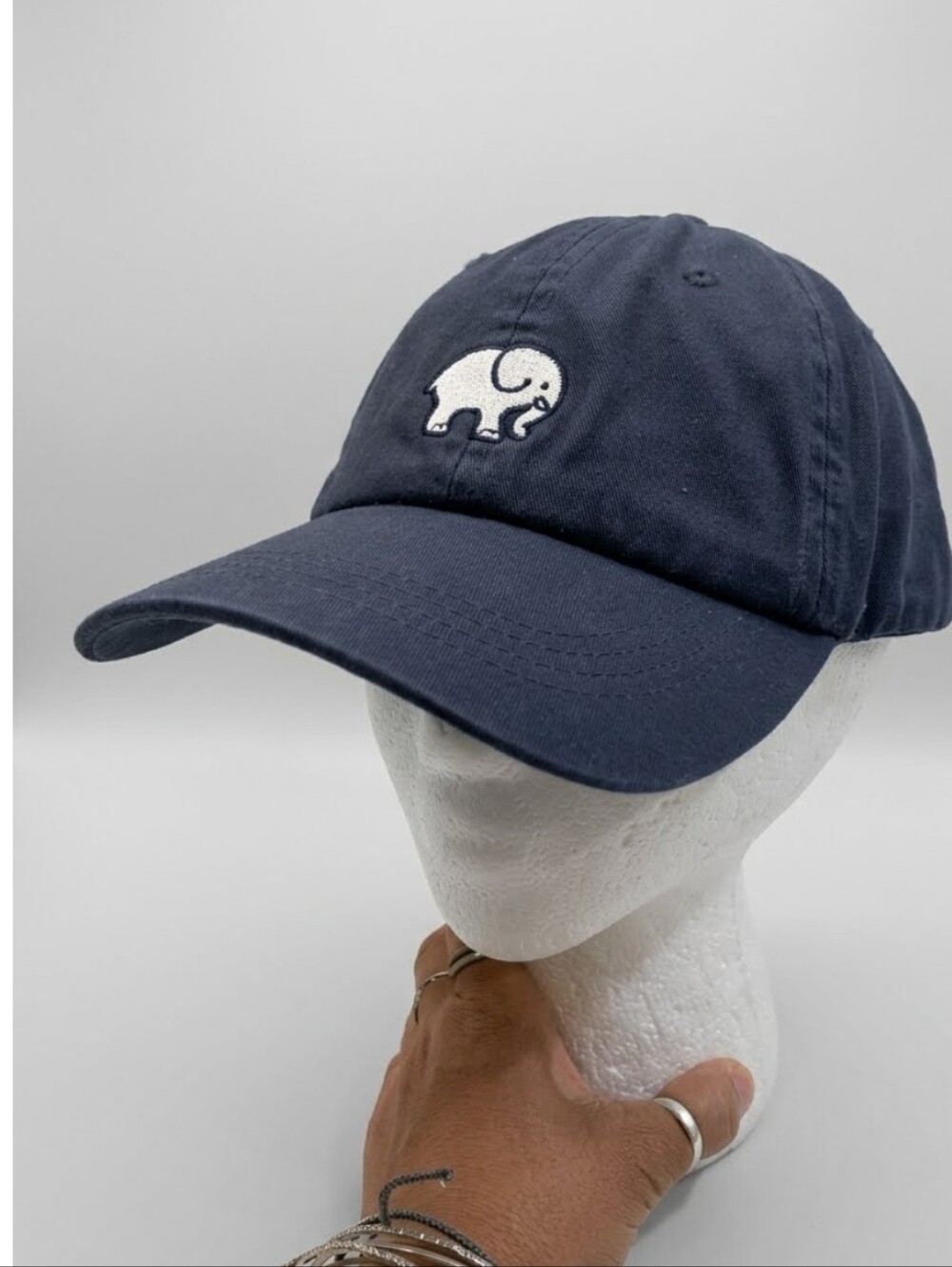 ivory ella navy Cotton hat with white elephant tag Adjustable